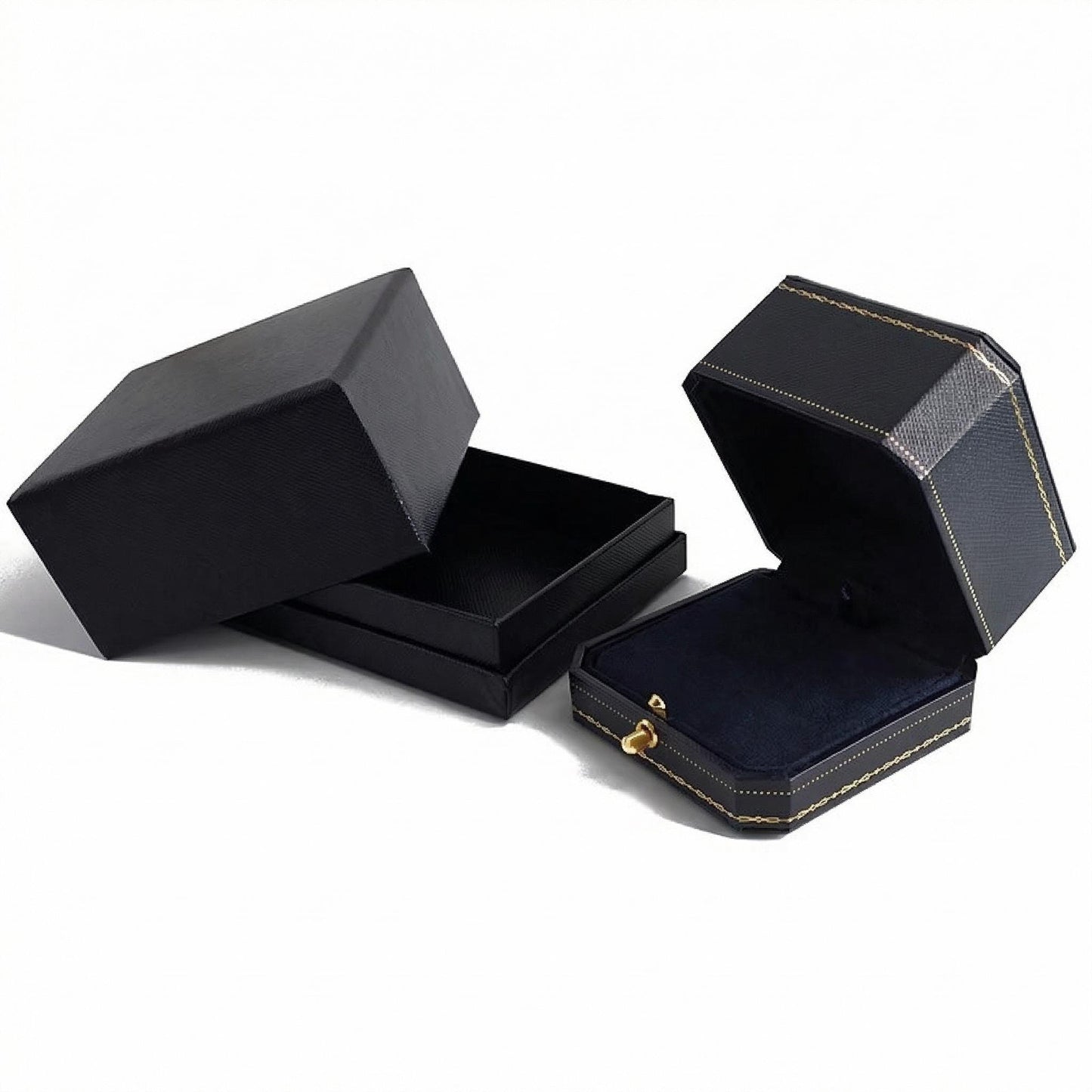 Black jewelry box with gold accents on a white background