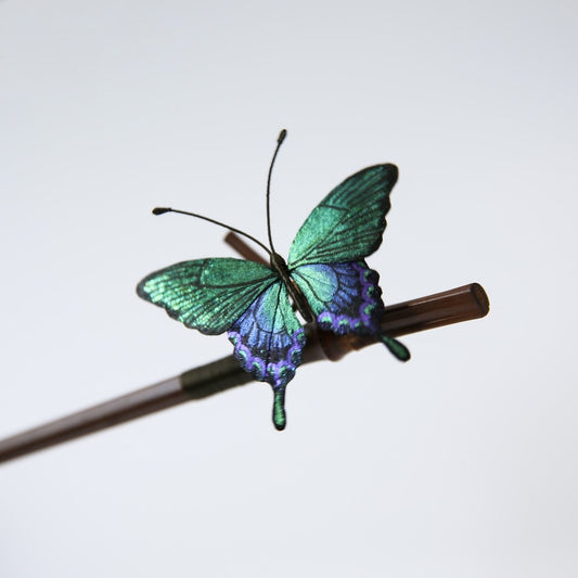 Detail of mulberry silk velvet butterfly wing on bamboo hair stick