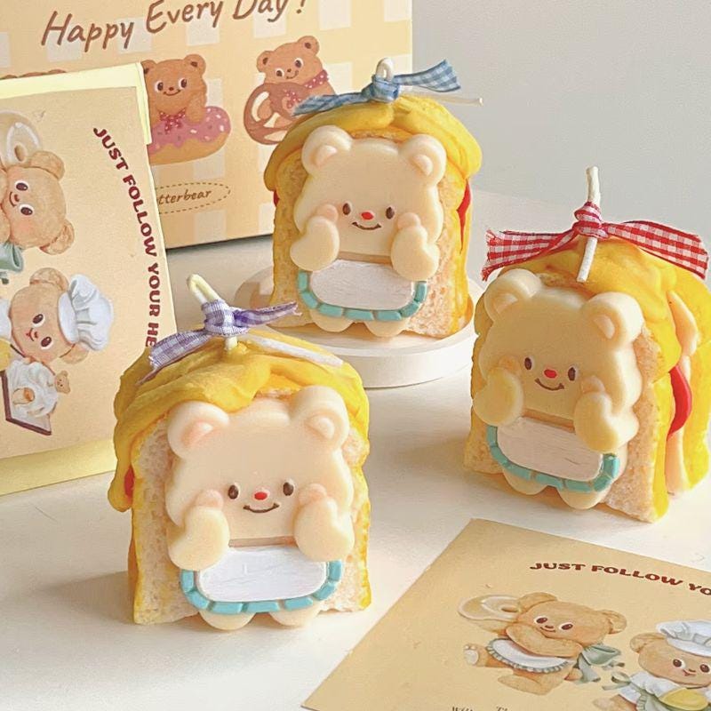 Cute bear-shaped soap bars with a smiling face on a light background