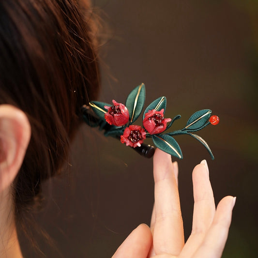 Handmade Chanhua pomegranate flower hairpin with red silk-wrapped petals and green leaves