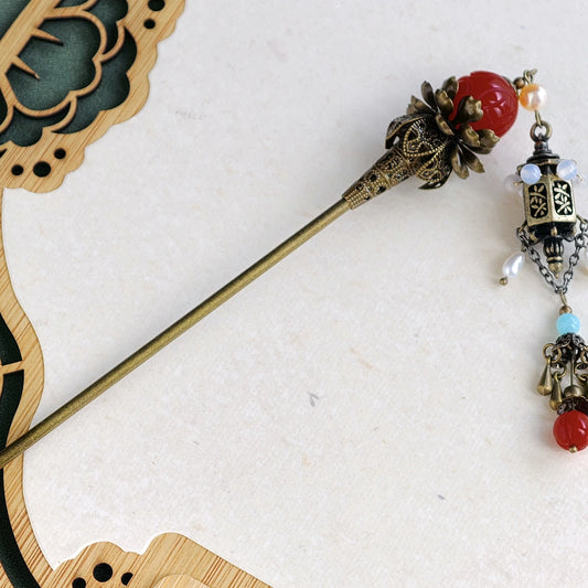 Side view of handcrafted Chinese palace style lantern hairpin for photography