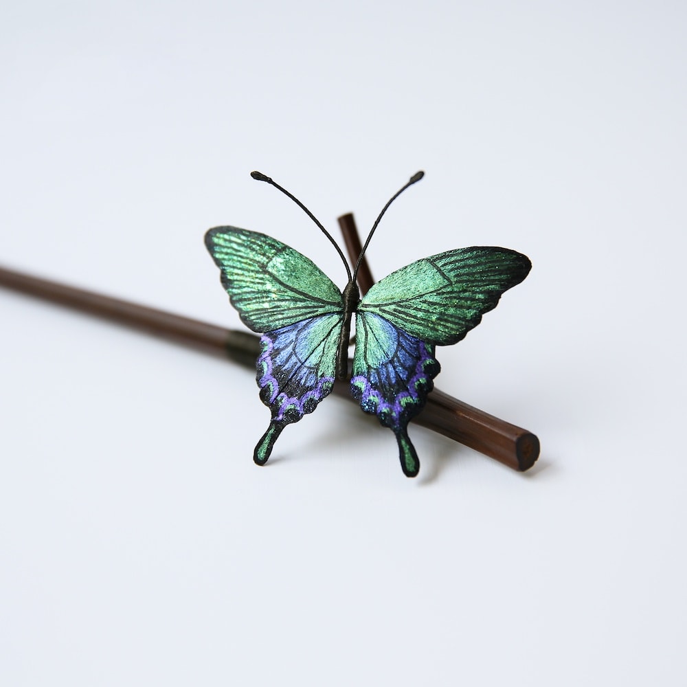 Close up of the mulberry silk velvet butterfly wing on bamboo hair stick