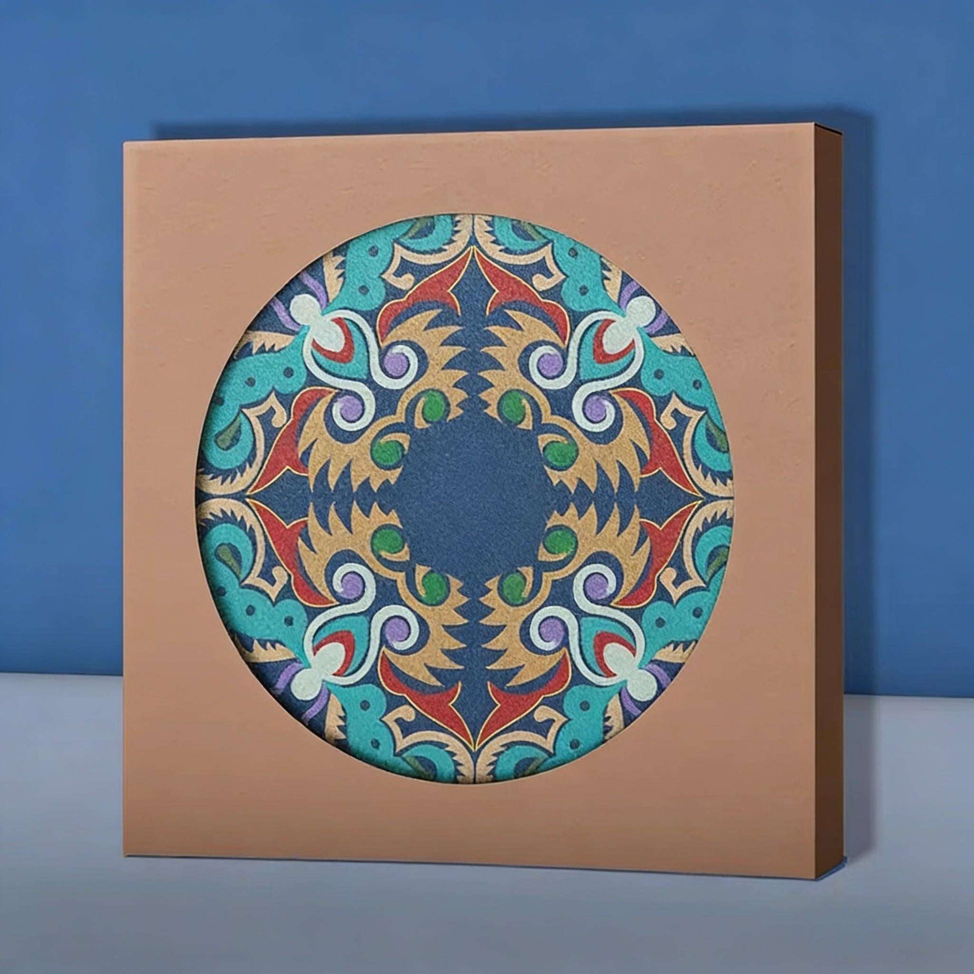 Coaster box with a colorful circular design on a blue background