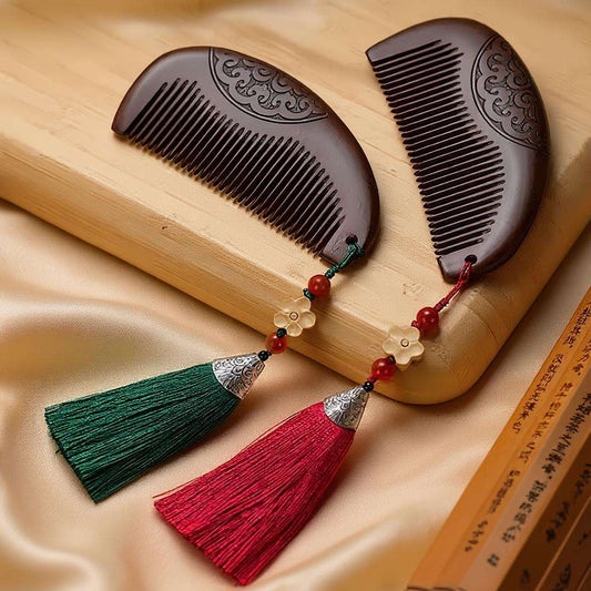 Decorative wooden combs with tassels on a beige fabric background