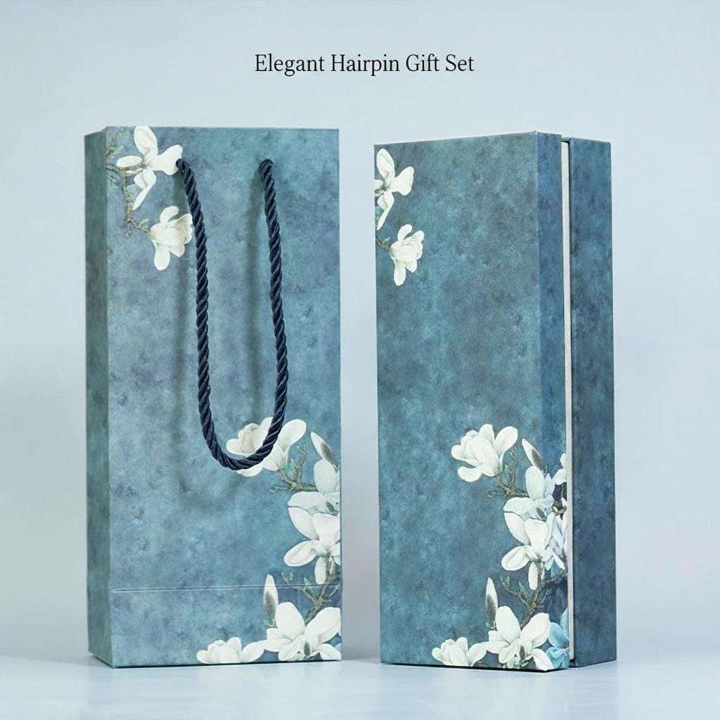 Elegant hairpin gift set packaging with floral design on a light blue background