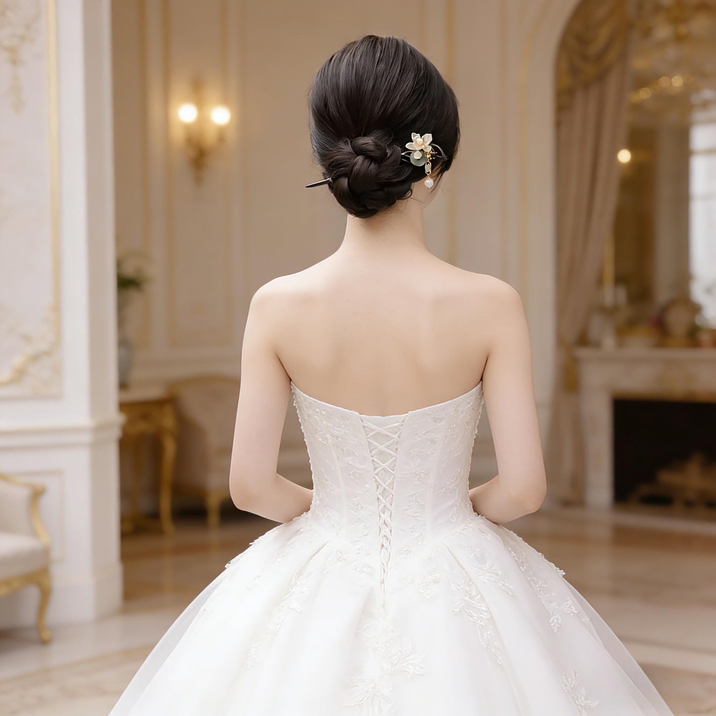 Woman in a white strapless gown with elegant hair styling in an opulent room.