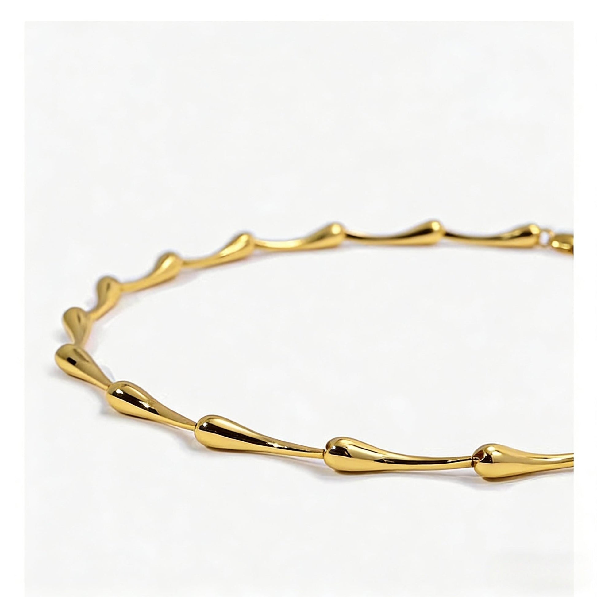Gold bracelet on a white background