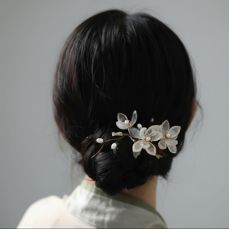 Hair accessory with floral design on a bun