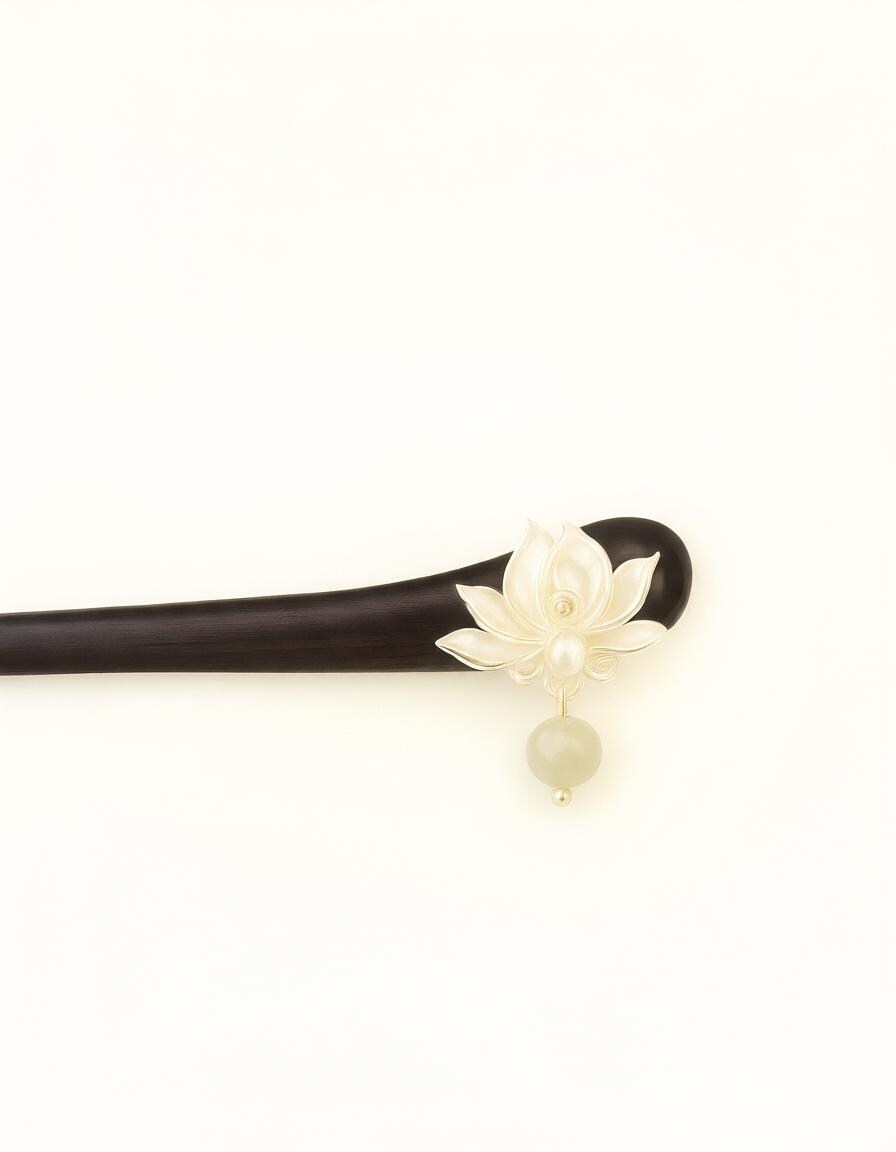 Hair stick with a white floral design on a white background