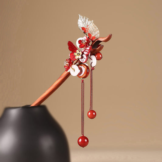 Handcrafted red sandalwood butterfly hairpin with white agate and copper tassels for Hanfu wedding.