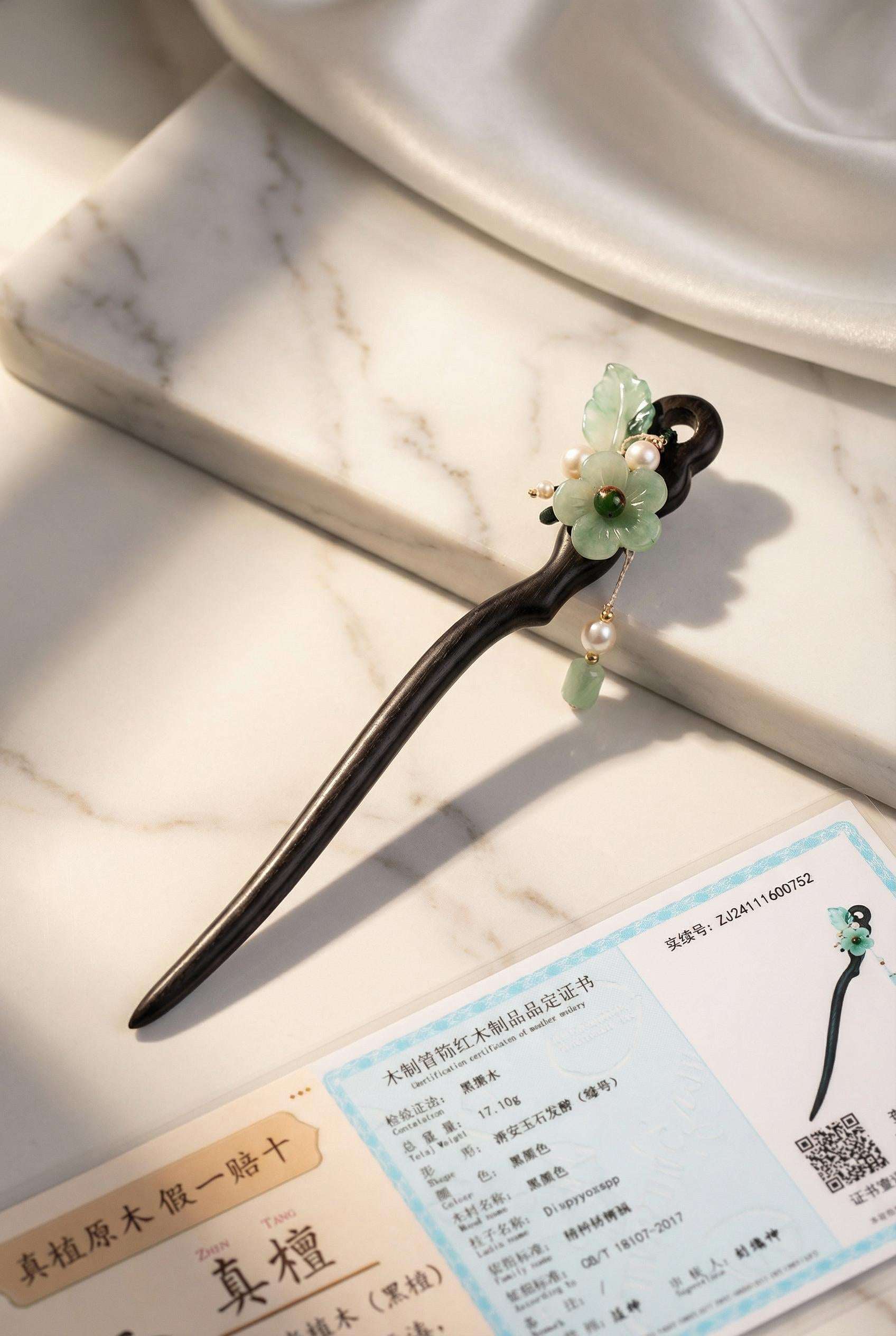 Decorative hairpin with floral design on a marble surface
