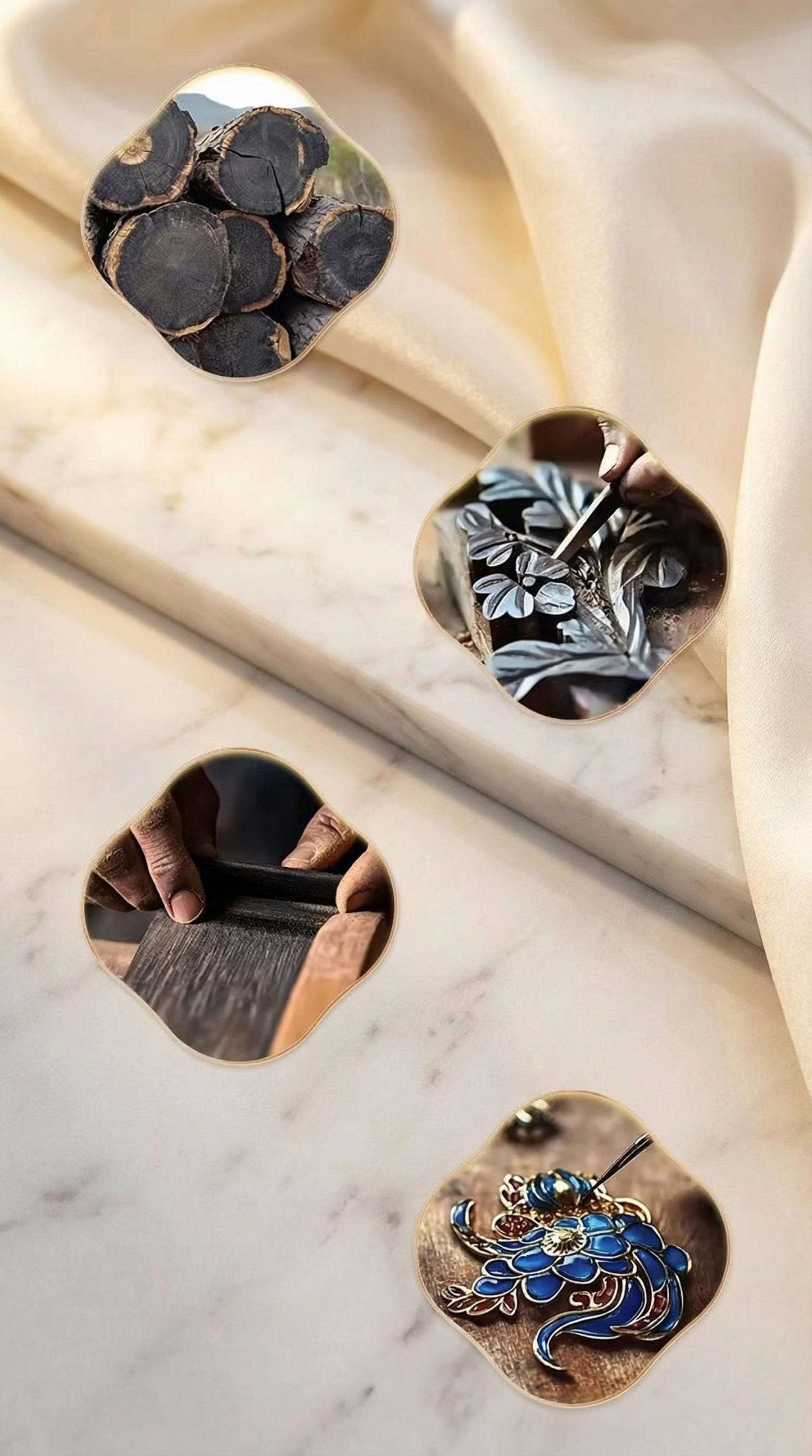 Decorative metal pieces with floral and leaf designs on a marble surface