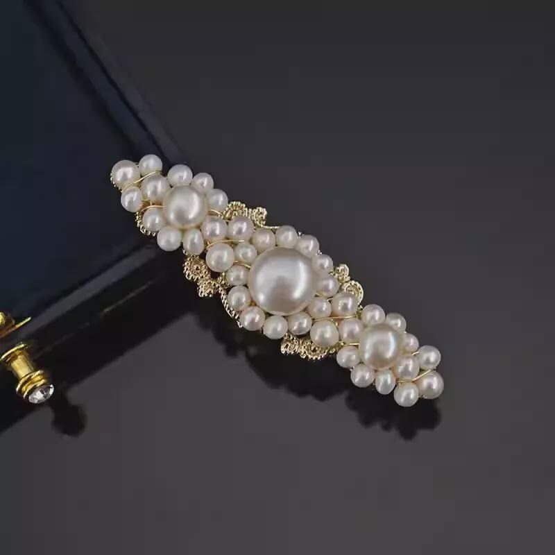 Pearl hair clip on a dark background