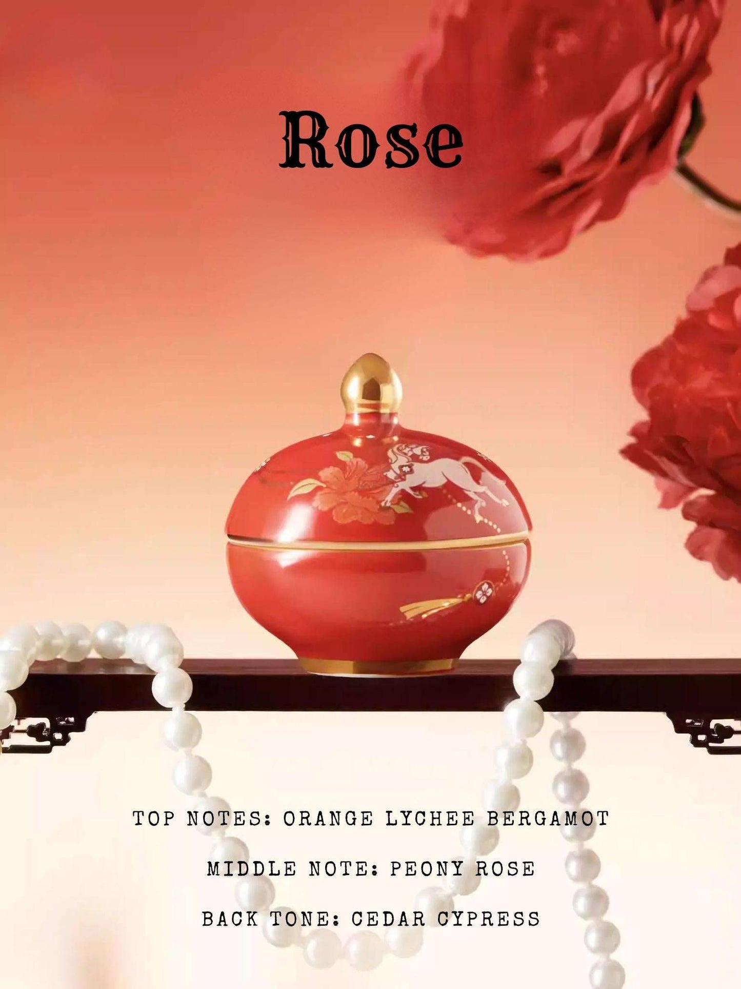 Red perfume bottle with gold accents on a white surface, surrounded by red flowers and pearls.