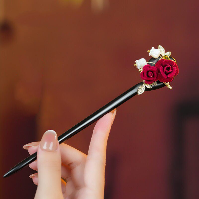 Sustainable polished wooden base of red rose hair stick