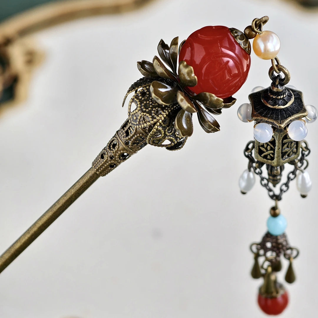 Detail of antique bronze lantern pendant and freshwater pearls on Hanfu hair stick