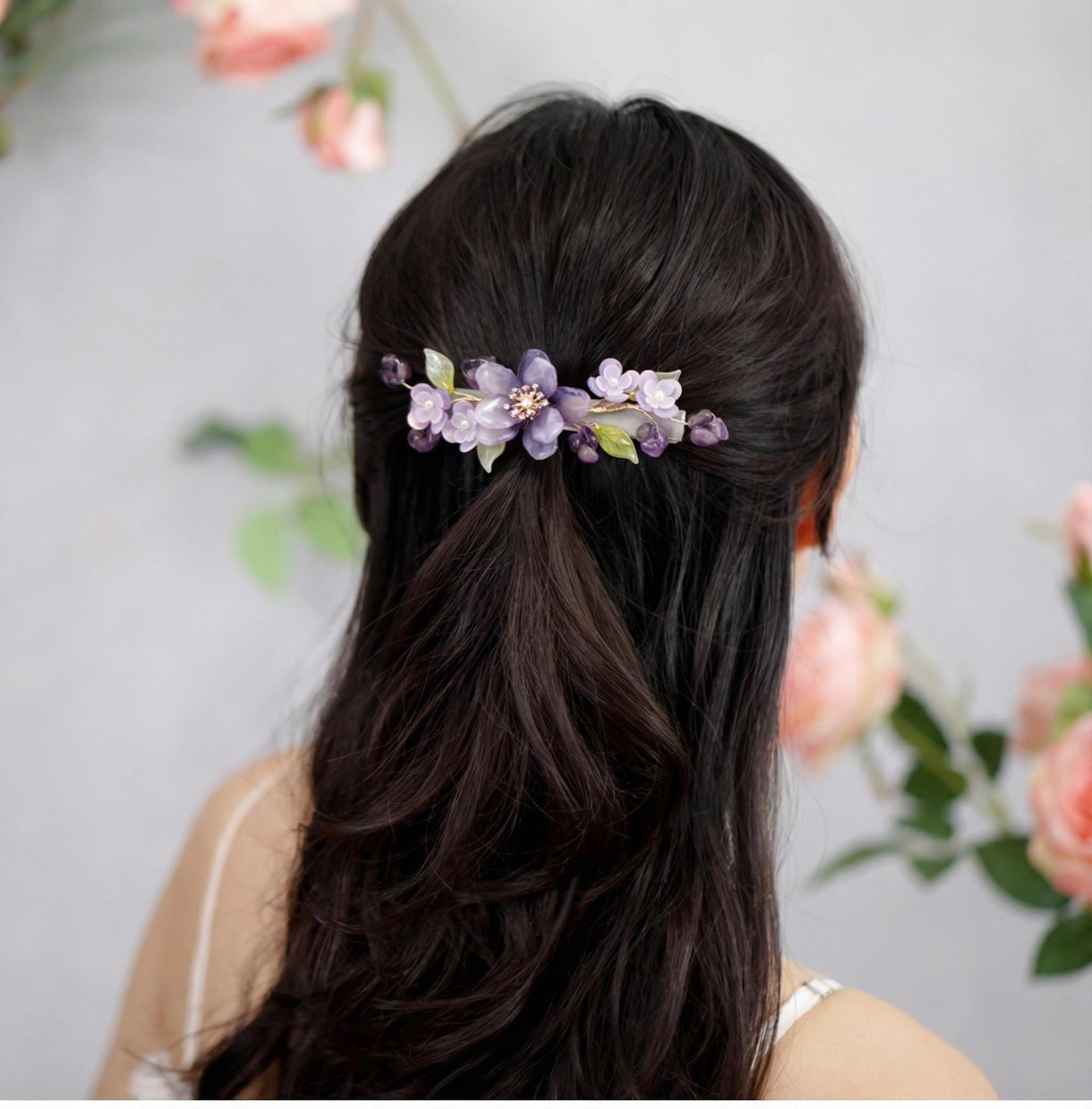 Woman with Purple Peony Ronghua Velvet Flower Hair Clip against a floral background