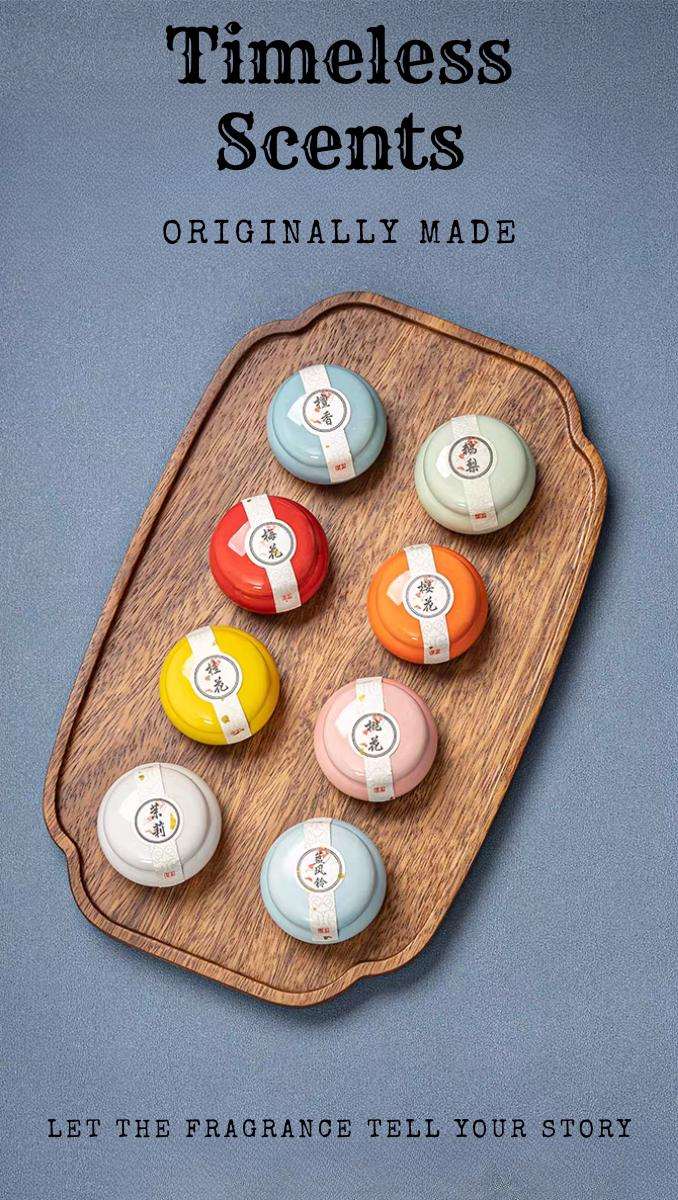 Wooden tray with colorful bath bombs labeled 'Timeless Scents' on a gray background.