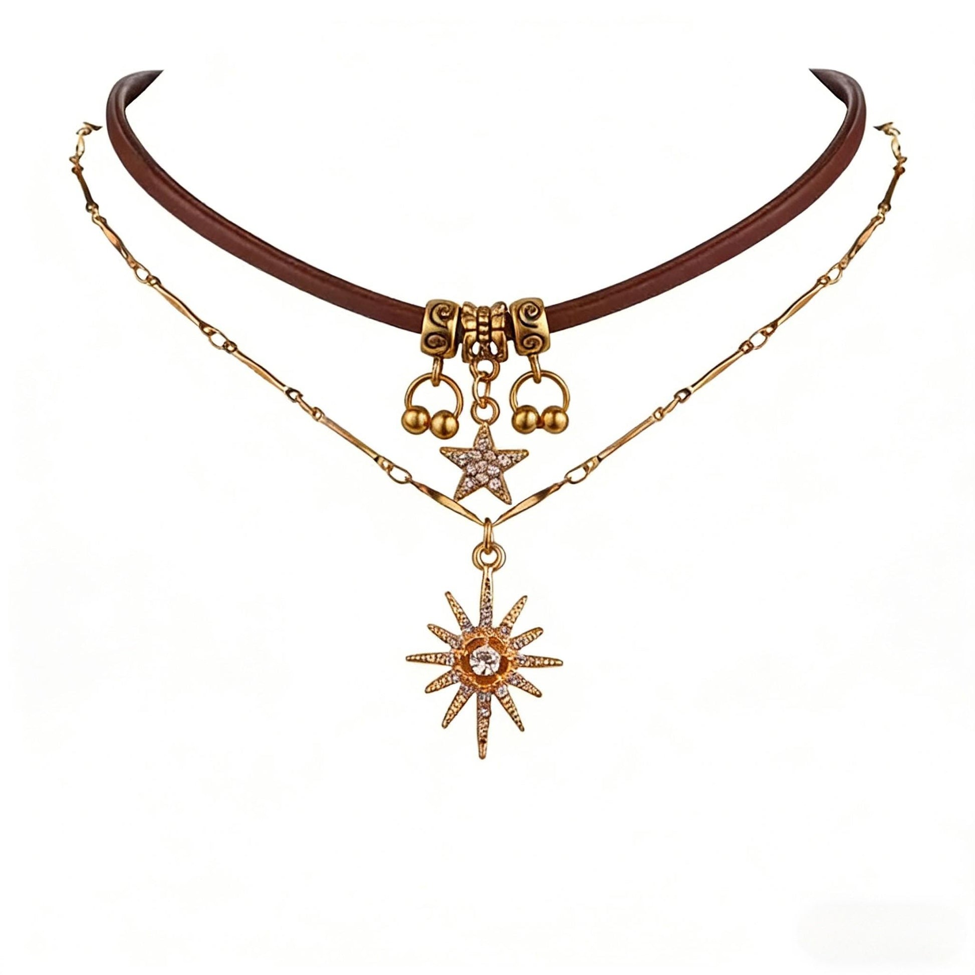 Gold necklace with star and ball pendants on a white background