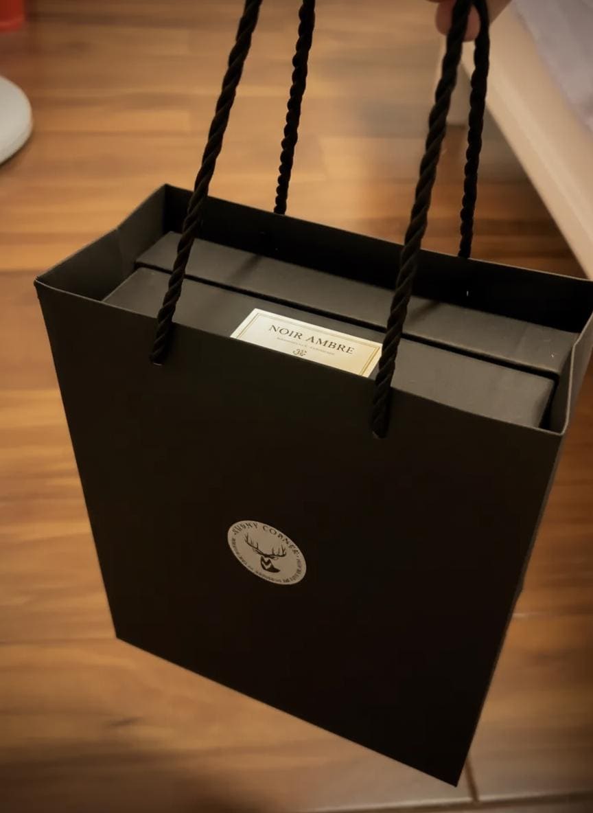 Gift Box with handles on a wooden surface
