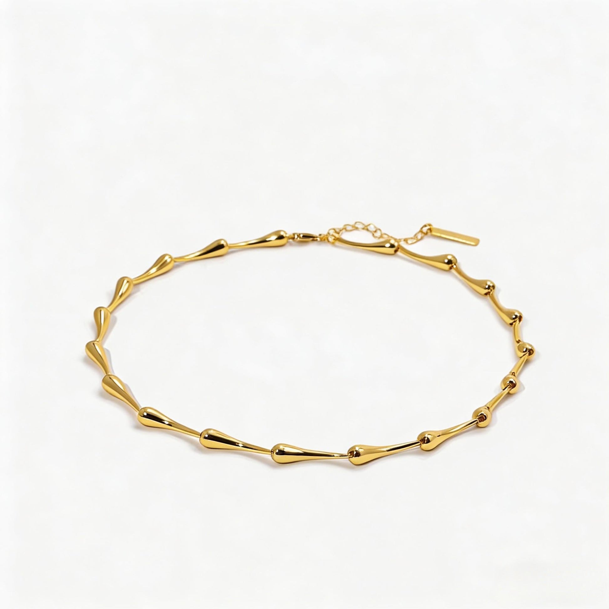 Gold bracelet on a white background