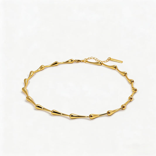 Gold bracelet on a white background