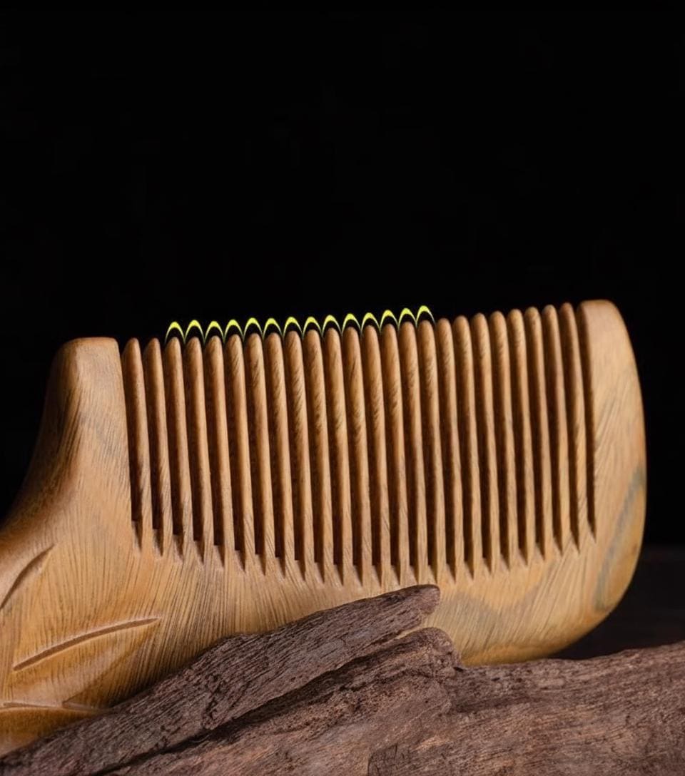 Wooden comb on a dark background
