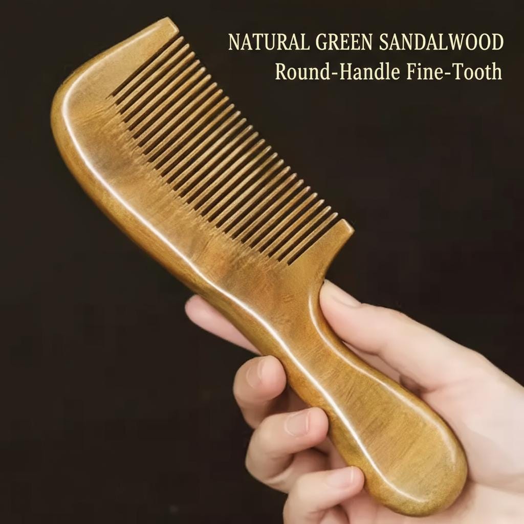 Hand holding a natural green sandalwood comb with text on a dark background