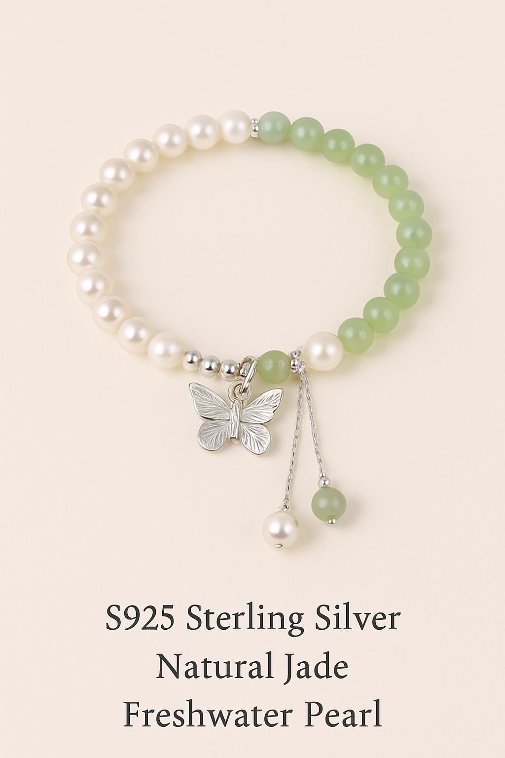 Bracelet with pearls, green beads, and a silver butterfly charm on a beige background.
