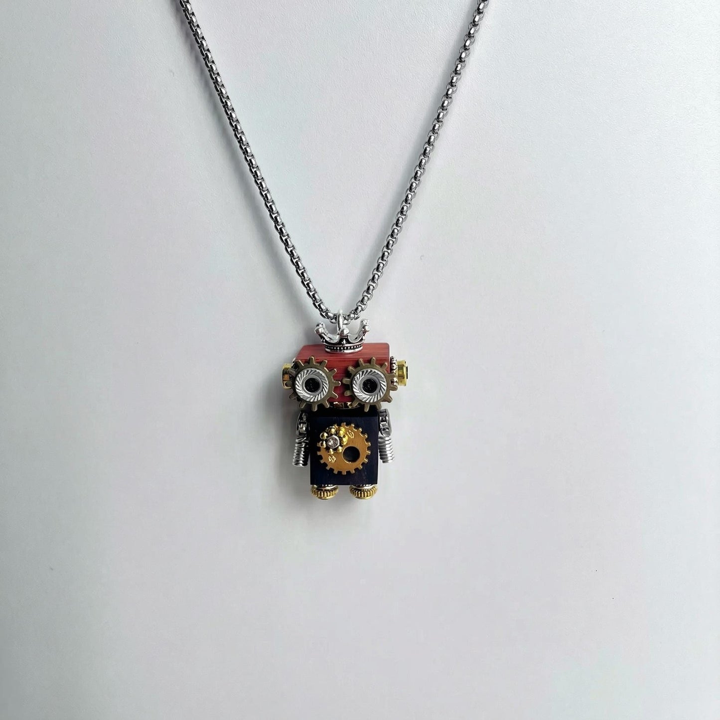 Necklace with a robot pendant on a white background