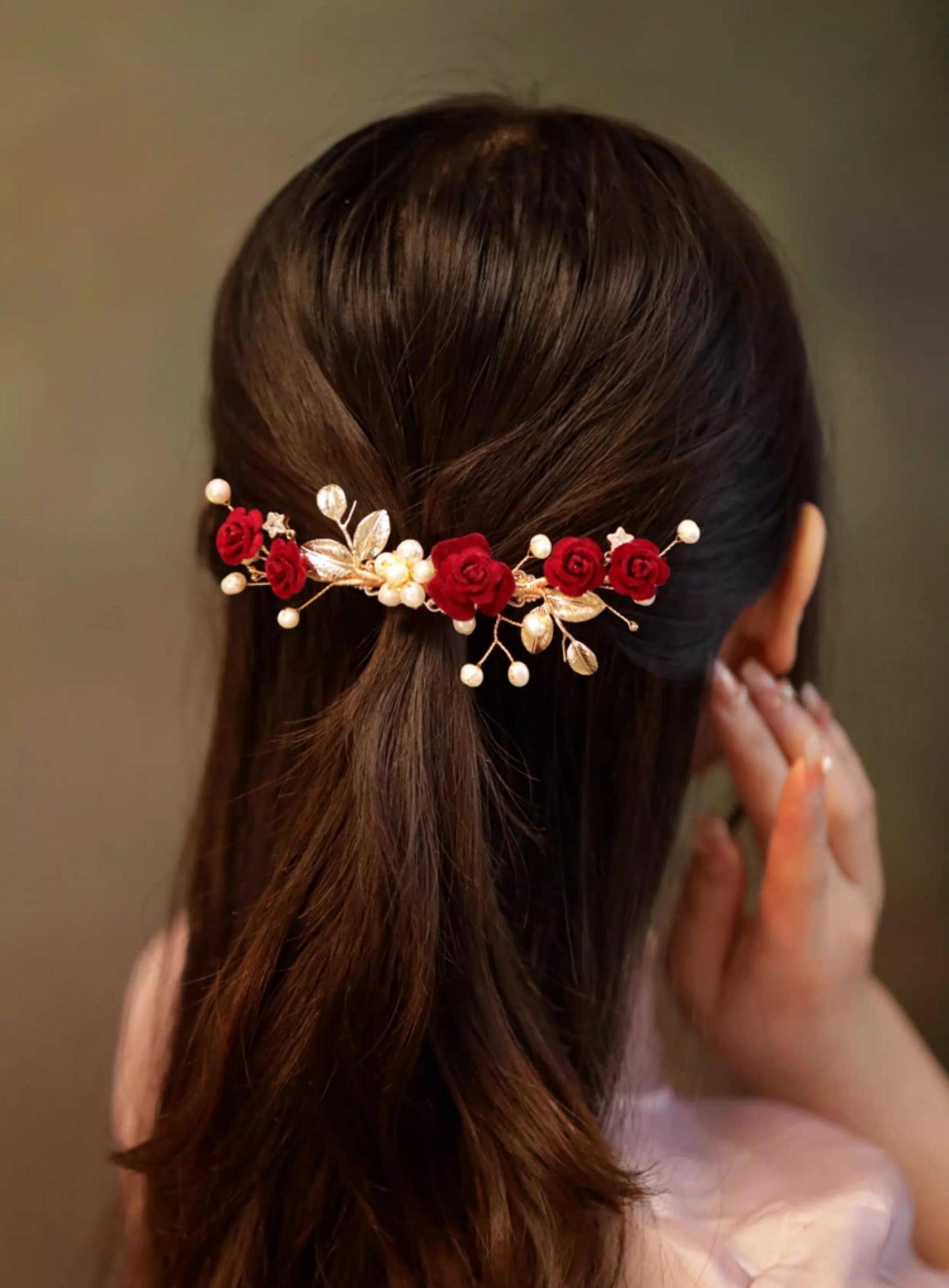 Woman with a Red Poppy Ronghua Velvet Flower Hair Clip against a neutral background