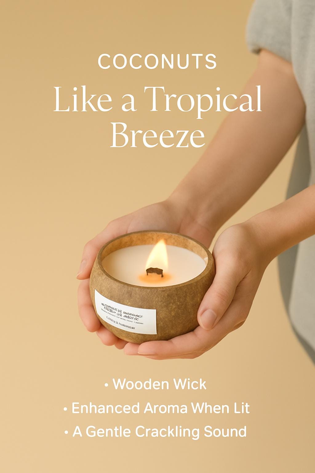 Candle with wooden wick held by a person against a beige background